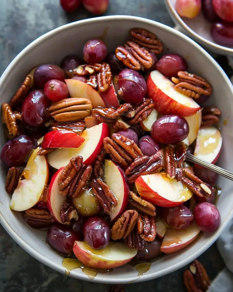 Irresistible Cinnamon-Spiced Apple and Red Grape Salad with Toasted Pecans and Honey Drizzle