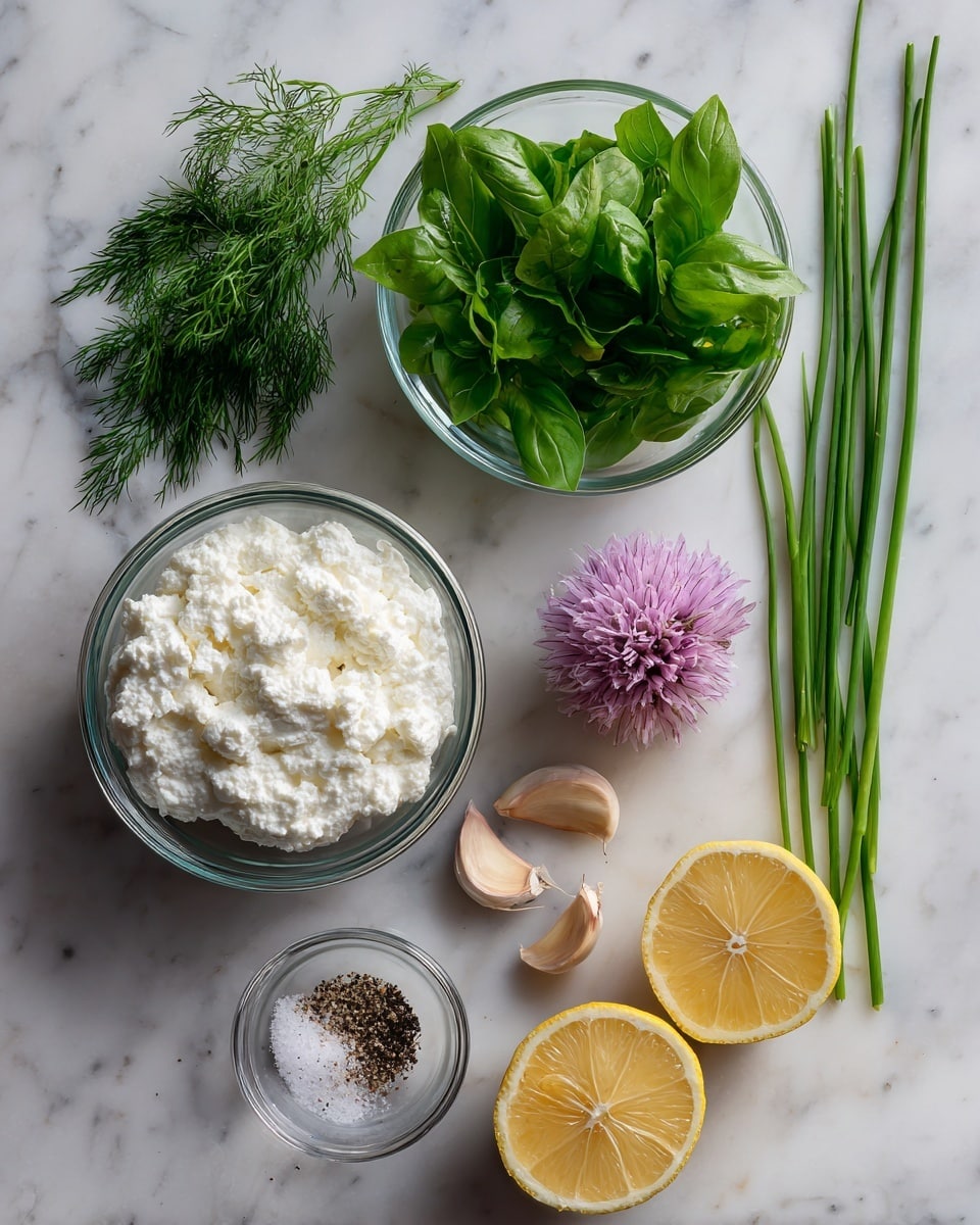 A top view shows fresh ingredients on a white marbled surface. There is one small round clear bowl filled with white cottage cheese, placed near the bottom left. Above it, another round clear bowl holds green leafy herbs including basil, dill, and cilantro. To the right of the herbs, light purple shallot and two peeled garlic cloves rest on the surface. At the bottom right, a lemon is cut into two halves showing its bright yellow inside. Next to the lemon halves is a small clear bowl with white salt and black pepper. Long green chives lay diagonally above the lemon. Photo taken with an iphone --ar 4:5 --v 7