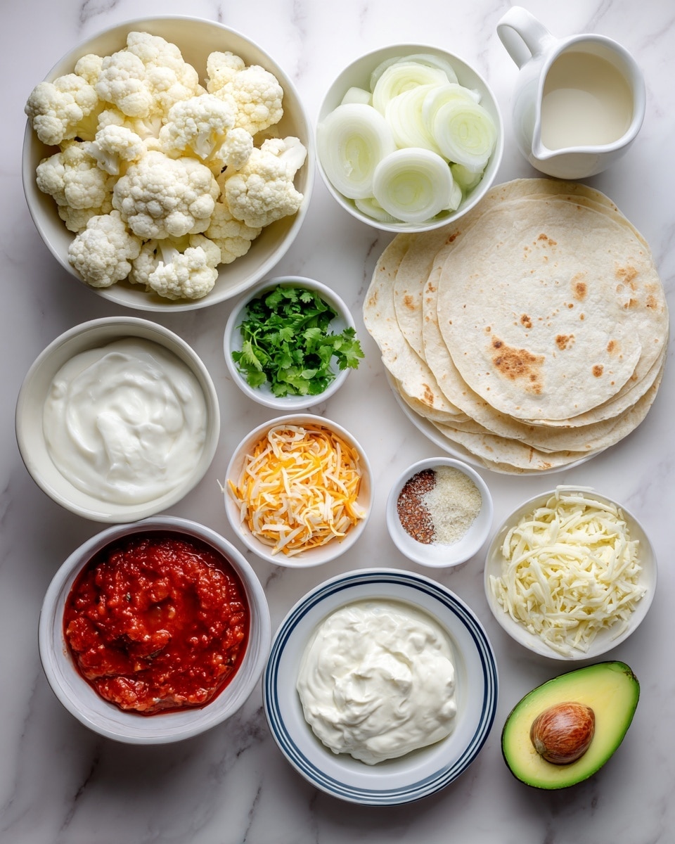 The image shows a flat lay of various ingredients on a white marbled surface. In the center left, a white bowl is full of small white cauliflower florets. Above it, a white bowl contains thinly sliced white onions. Next to the onions, there is a small pile of chopped green cilantro herbs in a white bowl. To the right of the cauliflower, a stack of white corn tortillas rests on a white plate with a blue rim. Below the cauliflower, there is a white bowl of thick white sour cream and another white bowl filled with red salsa sauce. Above those, shredded orange and white cheeses fill another white bowl. Small white bowls are scattered around containing red tomato sauce, melted butter, garlic paste, salt, black pepper, and an off-white crumbly cheese. Two halves of a green avocado with one seed in one half sit at bottom right. At the top right, a white jug of cream is placed. The whole setup has a bright, clean look. photo taken with an iphone --ar 4:5 --v 7
