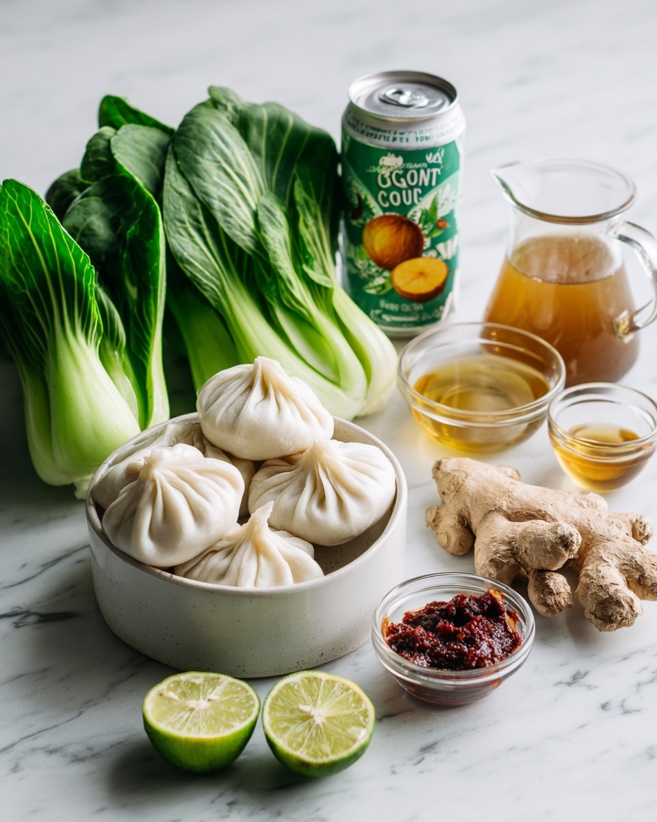 A white bowl holds a stack of white dumplings with soft folds, placed near three fresh green bok choy heads with bright and crisp leaves, all on a white marbled surface. Next to them is an opened can of unsweetened coconut milk with a colorful label showing a coconut, surrounded by a clear glass pitcher filled with light brown broth, a small glass bowl of golden oil, a smaller glass bowl of light brown liquid, a fresh green chili, a small glass bowl of thick red paste, a piece of fresh ginger root, and two halves of a bright green lime showing their juicy inside. photo taken with an iphone --ar 4:5 --v 7