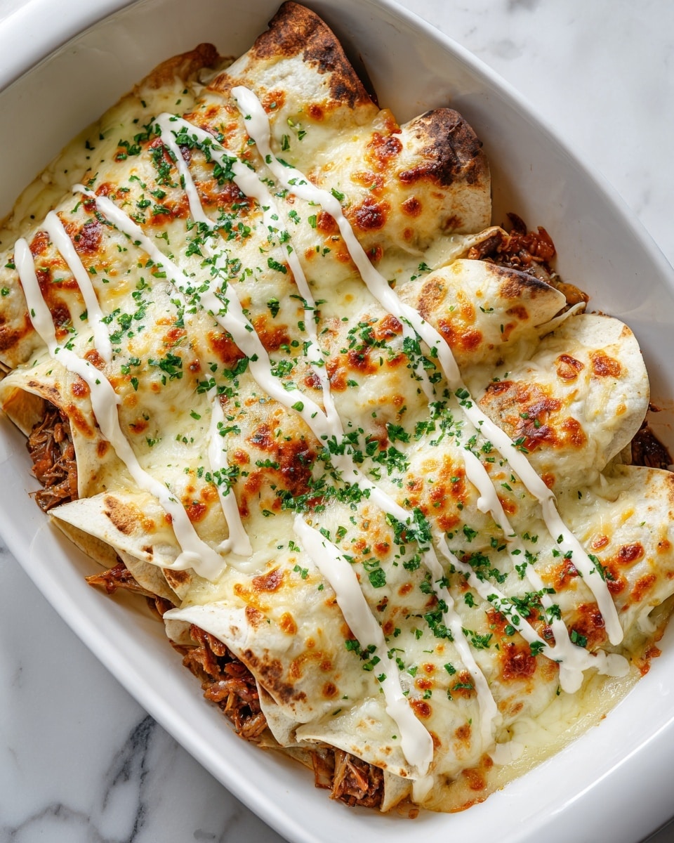 A white dish holds four rolled tortillas filled with shredded cooked meat, visible at the bottom edges. The tortillas are covered with a thick layer of golden melted cheese that has browned spots on top. Over the cheese, there are drizzles of creamy white sauce sprinkled with finely chopped green herbs evenly spread across the dish. The edges of the tortillas have a toasted look, and the dish sits on a white marbled surface. photo taken with an iphone --ar 4:5 --v 7
