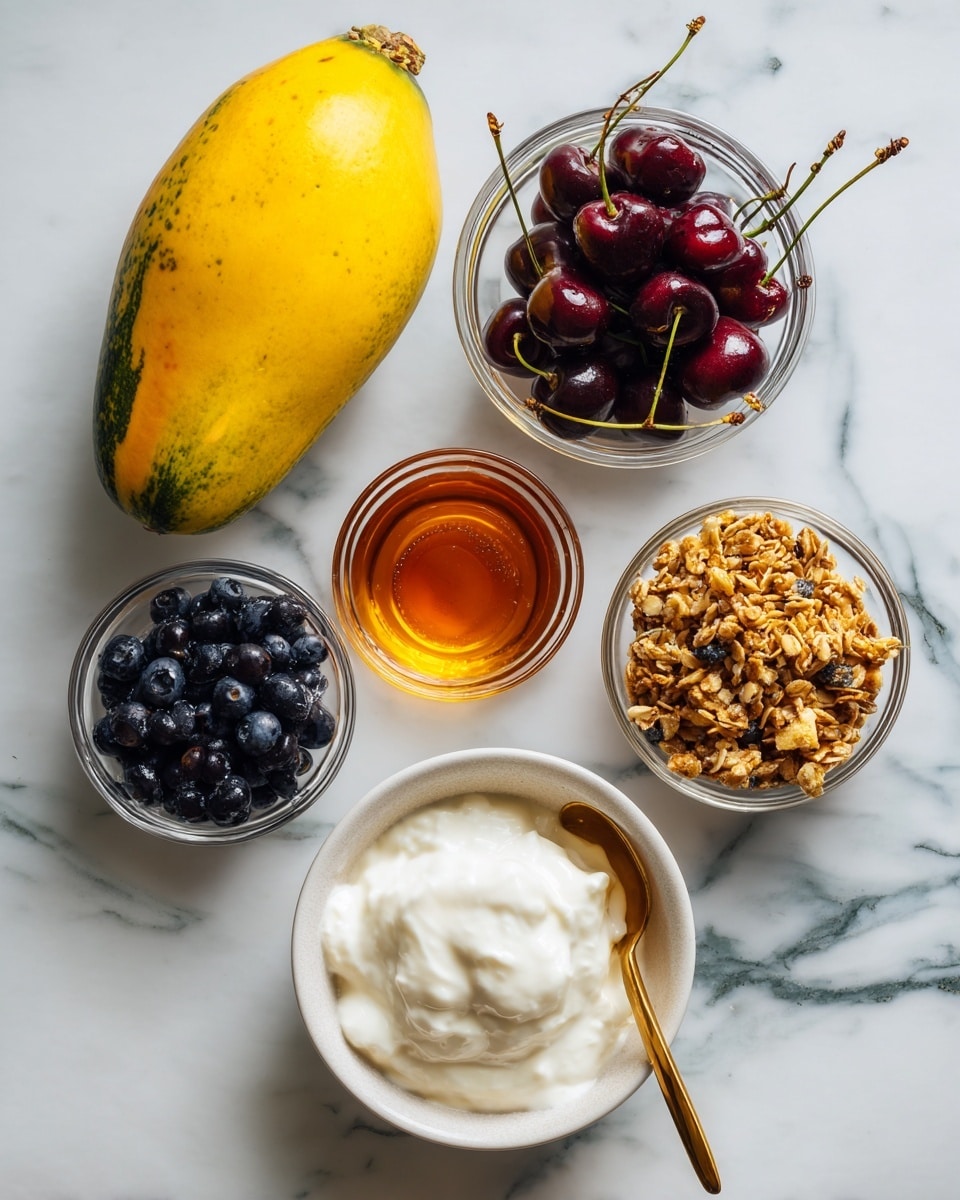 The image shows several ingredients on a white marbled surface arranged neatly: one whole yellow papaya with green patches on the left side, a small glass bowl filled with dark red and yellow cherries with stems, a small glass bowl of honey with a golden sheen, a small glass bowl with chunky light brown granola, a small glass bowl filled with dark blue blueberries, and a white bowl with smooth white yogurt with a golden spoon resting inside. Photo taken with an iphone --ar 4:5 --v 7