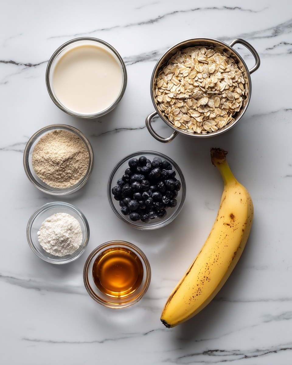 The image shows various ingredients set on a white marbled surface, each in clear or metal measuring cups and small glass bowls. There is a metal measuring cup filled with light brown rolled oats on the top right. Below it to the right is a ripe yellow banana with some brown spots. Below the banana is a metal measuring cup filled with small dark blueberries. To the left of the banana, there is a small glass bowl with a beige powder and above it, another small glass bowl holding white powder. Above the two small bowls is a clear glass measuring cup filled with a creamy light liquid, likely milk. In the center of the image, there is a small glass bowl with amber-colored liquid, probably syrup or honey. The arrangement is neat and evenly spaced. Photo taken with an iphone --ar 4:5 --v 7