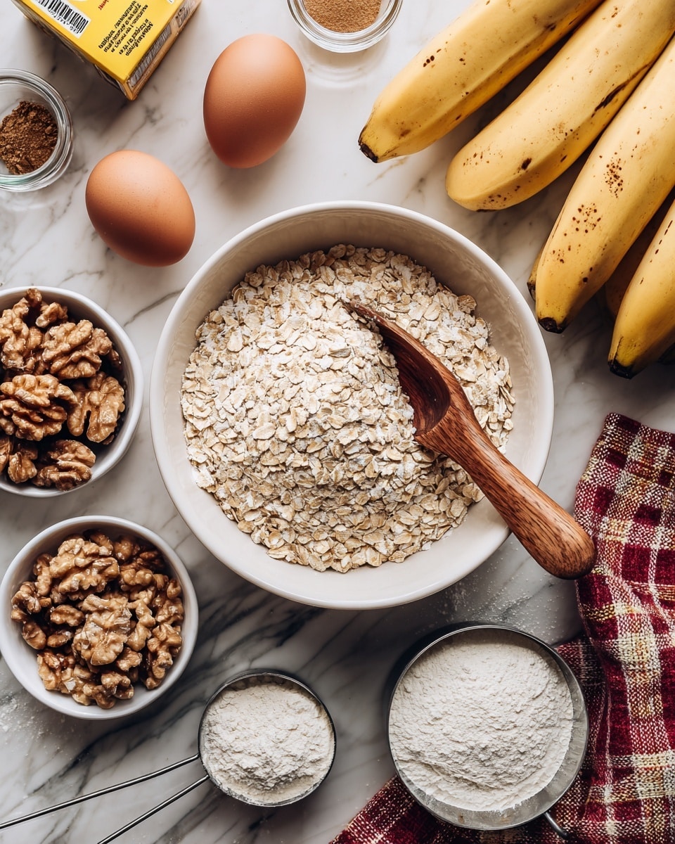 The image shows a white bowl in the center filled with light beige rolled oats and a wooden scoop resting inside. To the right, there is a bunch of ripe yellow bananas with small brown spots, lying on a white marbled surface. Around the bowl, there are two brown eggs and a small white bowl filled with shelled walnuts, light brown and textured. Next to the walnuts, there are two small glass jars containing light brown and dark brown spices. A yellow box of baking soda is in the upper left corner. Near the bottom, there are two metal measuring cups, one filled with white flour and the other with a darker flour. On the right side of the image is a red, yellow, black, and white checkered cloth, partially spread out. The background is a white marbled surface. photo taken with an iphone --ar 4:5 --v 7