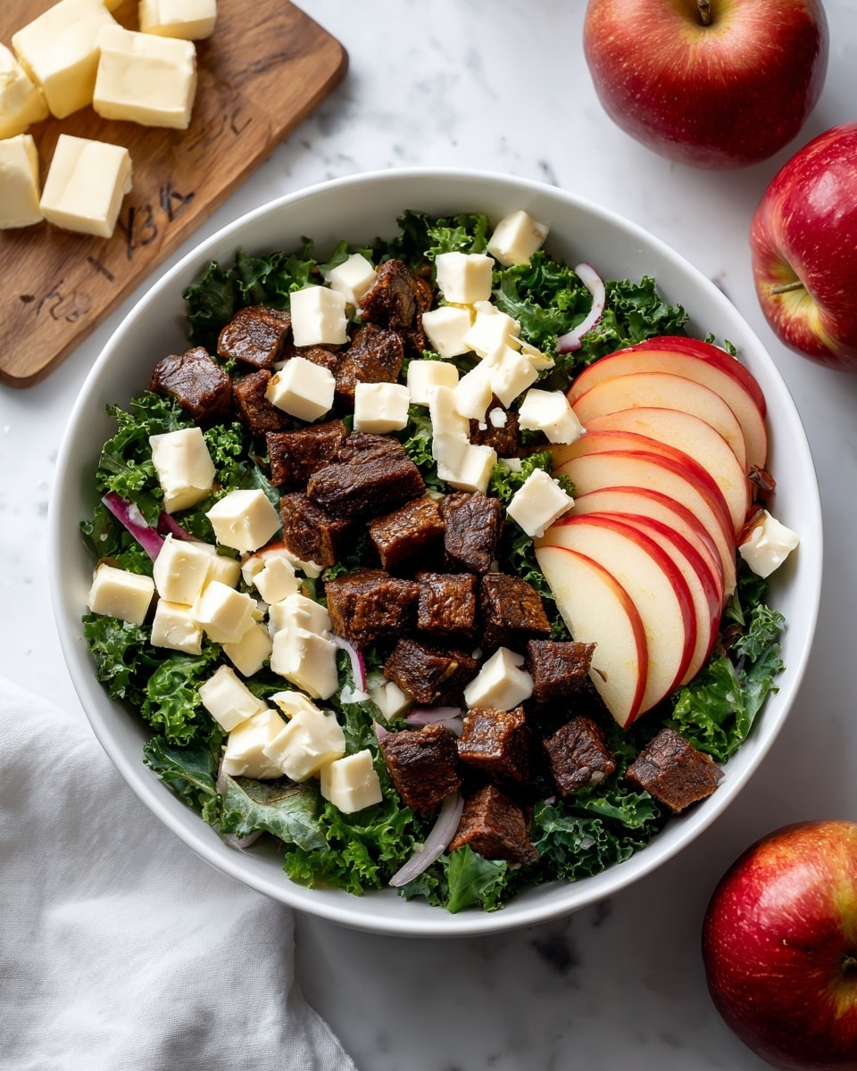 A white bowl filled with a fresh salad sits on a white marbled surface. The salad has several layers: at the bottom, bright green kale leaves make a textured base. On top, small dark brown cubes of tofu or meat are spread evenly. Thin slices of red and white apples are placed in curved rows on one side. Scattered white cheese cubes are spread evenly over the salad, adding a soft texture contrast. In the background, two whole apples and some cubes of butter rest on small wooden boards, adding color and context to the scene. photo taken with an iphone --ar 4:5 --v 7
