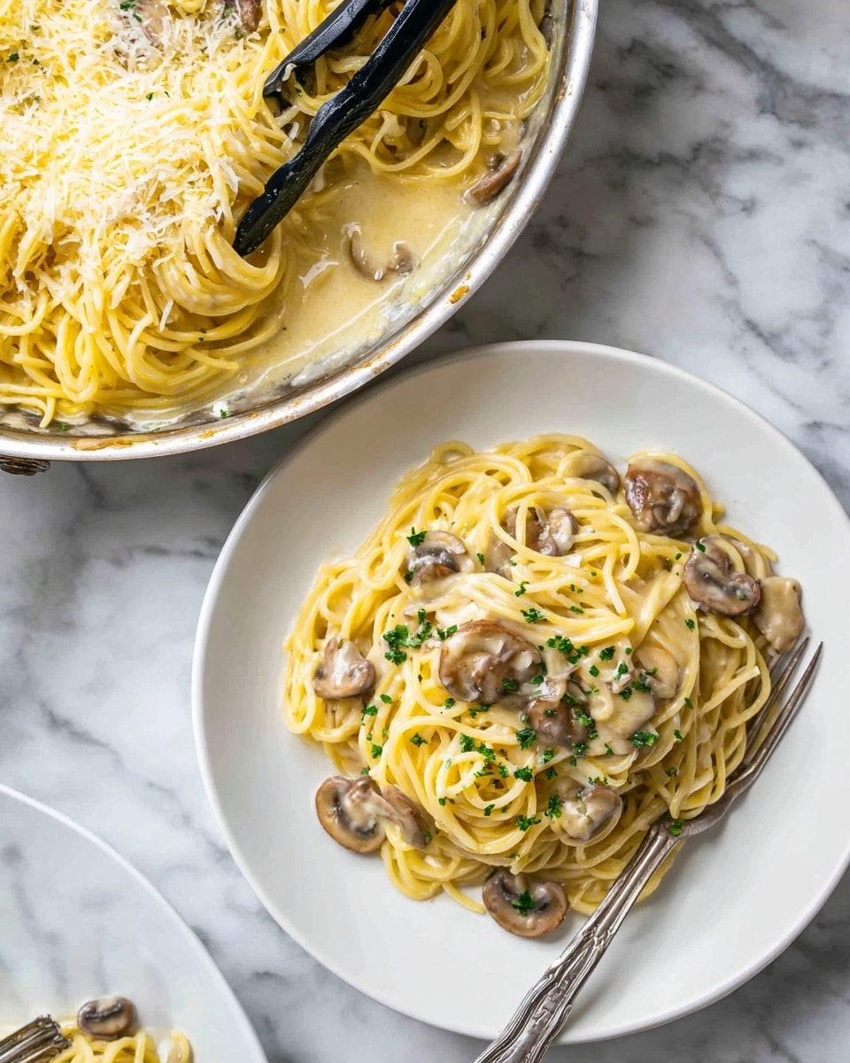 A white shallow bowl holds a single serving of spaghetti, twisted into a loose nest shape. The pasta is covered in a light yellow creamy sauce, creating a smooth, slightly shiny texture across the noodles. Grated cheese is sprinkled over one side, adding a more textured, crumbly layer. Black pepper flakes are scattered throughout, giving small dark specks on the pale sauce. A silver fork is placed on the right, its tines wrapped in spaghetti strands, partly covered by the creamy sauce. The bowl sits on a white marbled surface. photo taken with an iphone --ar 4:5 --v 7