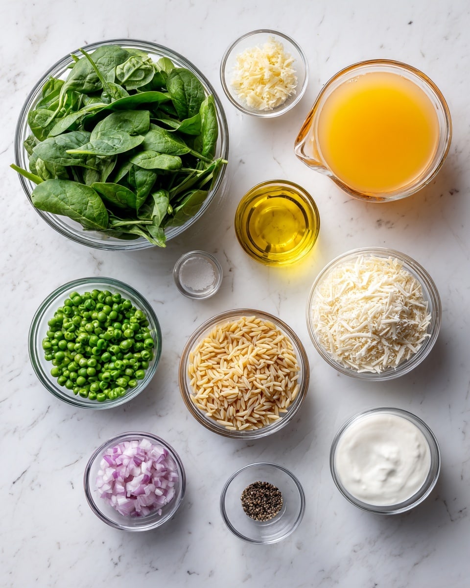The image shows various clear glass bowls arranged neatly on a white marbled surface. Starting from the top left, there is a large bowl filled with fresh green spinach leaves. Moving right, a small bowl contains minced garlic, next to it a small transparent measuring cup holds yellow lemon juice. Below that, another measuring cup has light yellow olive oil, and next to it a large measuring cup filled with orange broth. On the far right, a small bowl holds thick white sour cream. Below, there are five more glass bowls: one with chopped green snap peas, another large bowl with light brown orzo pasta, a bowl of diced purple shallots, a small one with salt and black pepper, and finally one filled with white grated cheese. The arrangement is clear and colorful, with fresh and dry ingredients grouped together, all set on a bright white marbled background. photo taken with an iphone --ar 4:5 --v 7