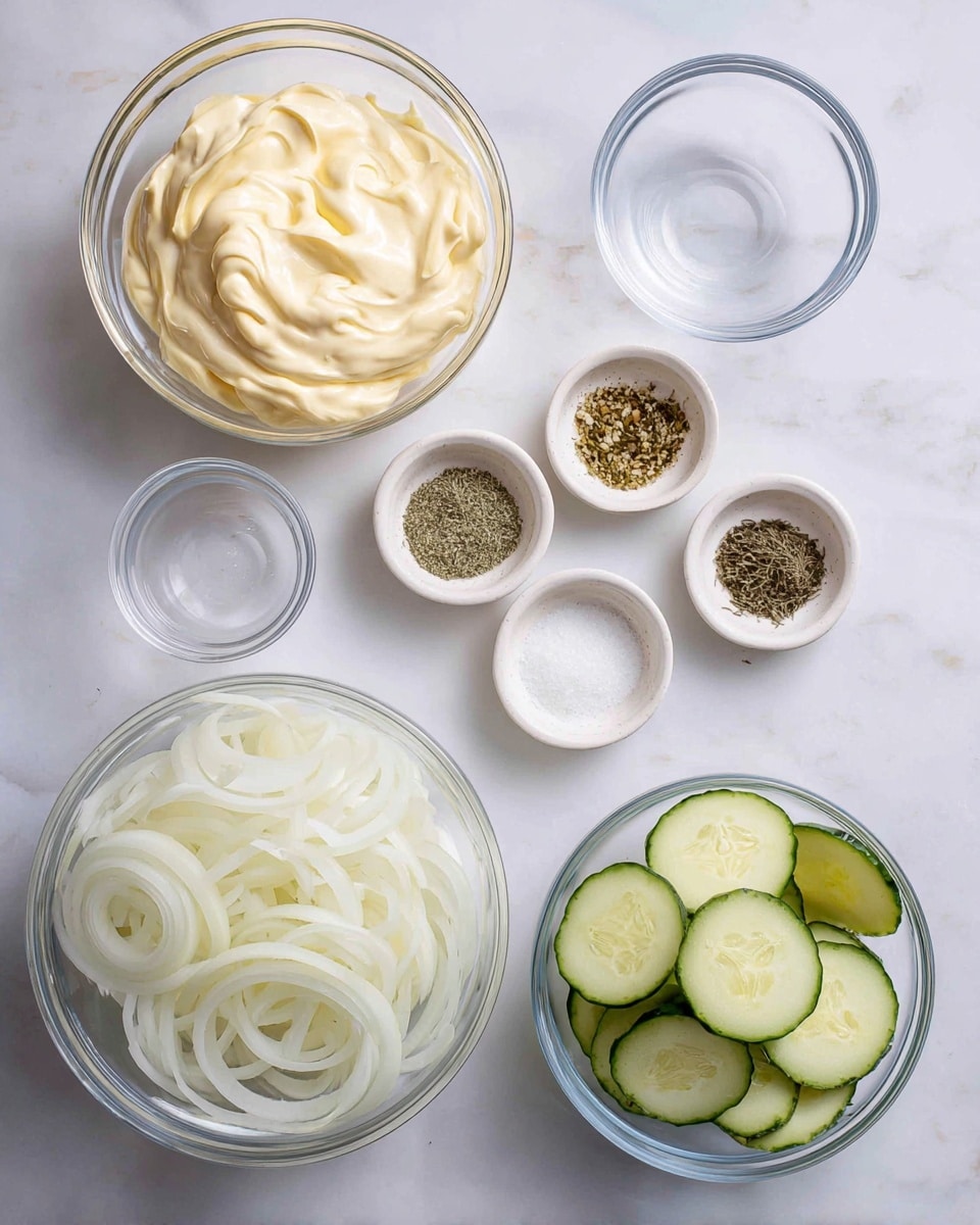 The image shows several glass bowls and small white speckled dishes arranged on a white marbled surface, each holding different ingredients. In the top left is a large glass bowl filled with creamy, pale yellow mayonnaise. Below it, a small empty glass bowl sits nearby. Center bottom holds a large glass bowl of thinly sliced white onions, and to the right is another large glass bowl filled with thin, pale green cucumber slices showing seeds. At the top center, five small white speckled dishes display seasoning powders and herbs in separated piles: garlic powder, dried dill, salt, black pepper, and sugar, arranged in a neat row. The overall look is clean and organized. Photo taken with an iphone --ar 4:5 --v 7