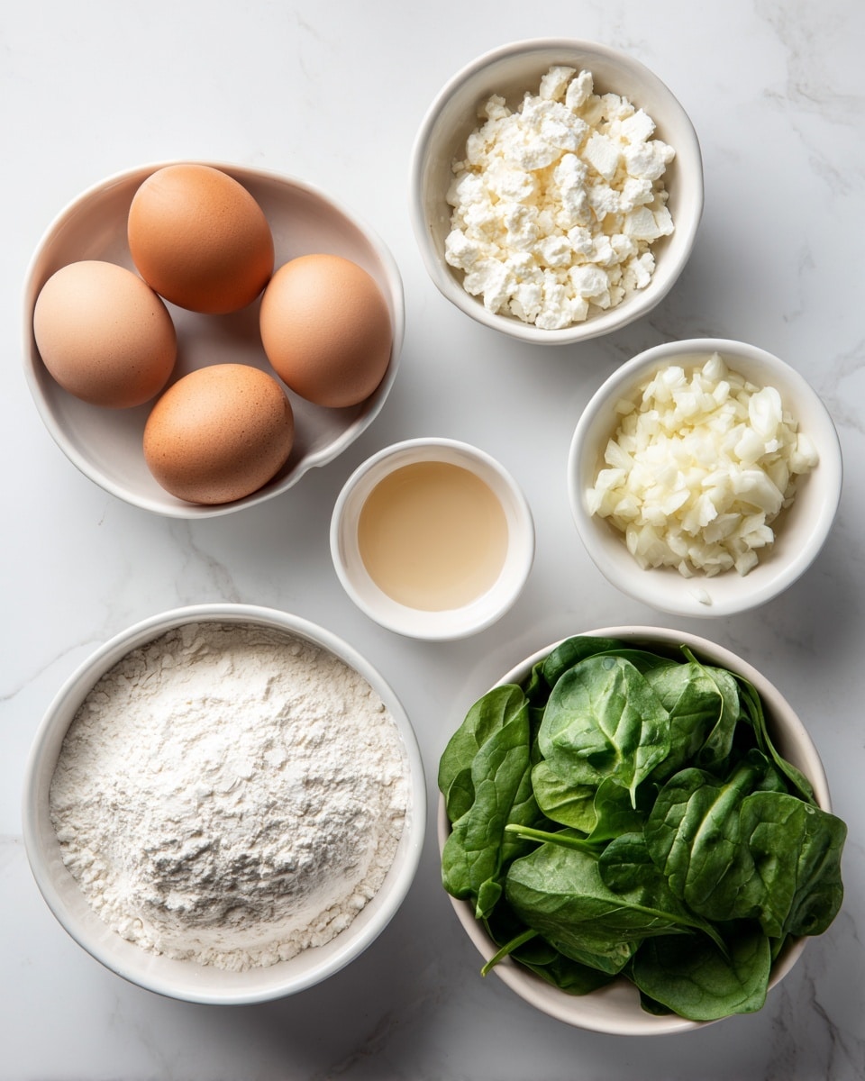 The image shows six white bowls on a white marbled surface. The top left bowl holds four whole eggs with brown and light brown shells. To the right of it is a small bowl filled with white crumbled cheese. Below the eggs, slightly to the left, is a small white bowl with a light brown liquid. Next to this bowl is another small bowl filled with white chopped garlic. To the right, a large white bowl is piled with fresh green spinach leaves. At the bottom center, a larger white bowl contains white flour. The bowls create a loose cluster with a simple, clean look. Photo taken with an iphone --ar 4:5 --v 7