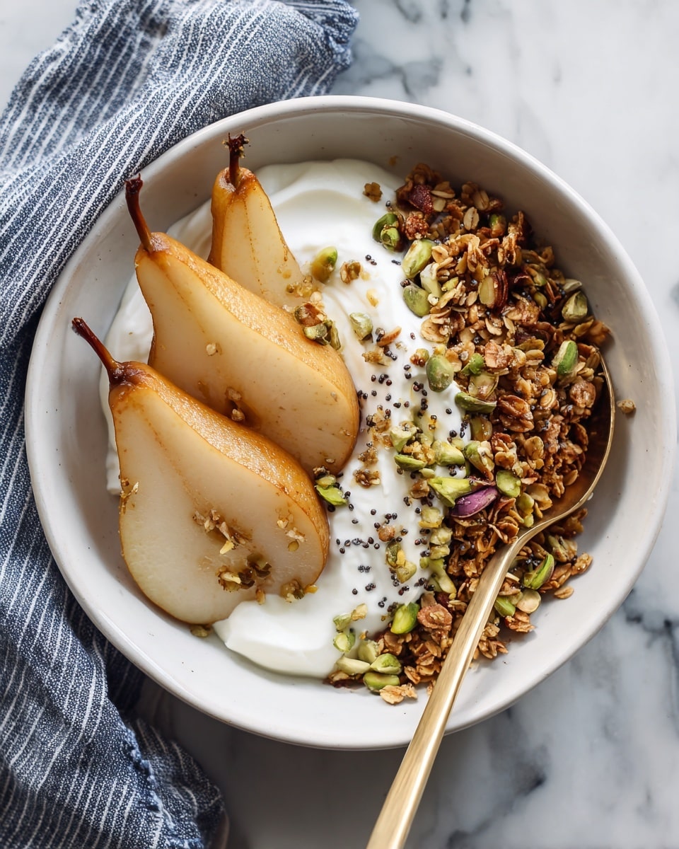 A white bowl contains three main layers, starting with a bottom layer of crunchy granola with a mix of oats and small seeds, light brown and slightly textured. On one side, there are three large slices of cooked pear, caramel brown with a soft texture and sprinkled with small black chia seeds and pistachio nuts. The other side shows a thick layer of smooth white yogurt, topped with a few more chia seeds and chopped bright green pistachios. A silver spoon rests on the edge of the bowl, and a gray and white striped cloth is placed nearby on a white marbled surface. Photo taken with an iphone --ar 4:5 --v 7