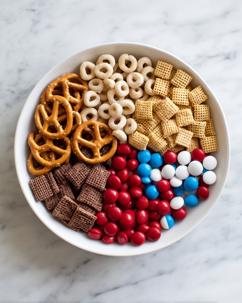A white bowl on a white marbled surface holds six distinct sections of snacks arranged side by side. Starting from the top and moving clockwise, there is a layer of pale tan circular cereal rings, followed by golden square cereal pieces with a woven texture. Next is a light brown square cereal with a rough texture, then a colorful middle cluster of smooth round candies in red, white, and blue. To the left of the candies are golden brown pretzel sticks with a slightly rough, salty surface, then a dark brown square cereal with a coarse woven pattern completes the circle. The colors and textures create a vibrant and balanced visual mix. photo taken with an iphone --ar 4:5 --v 7