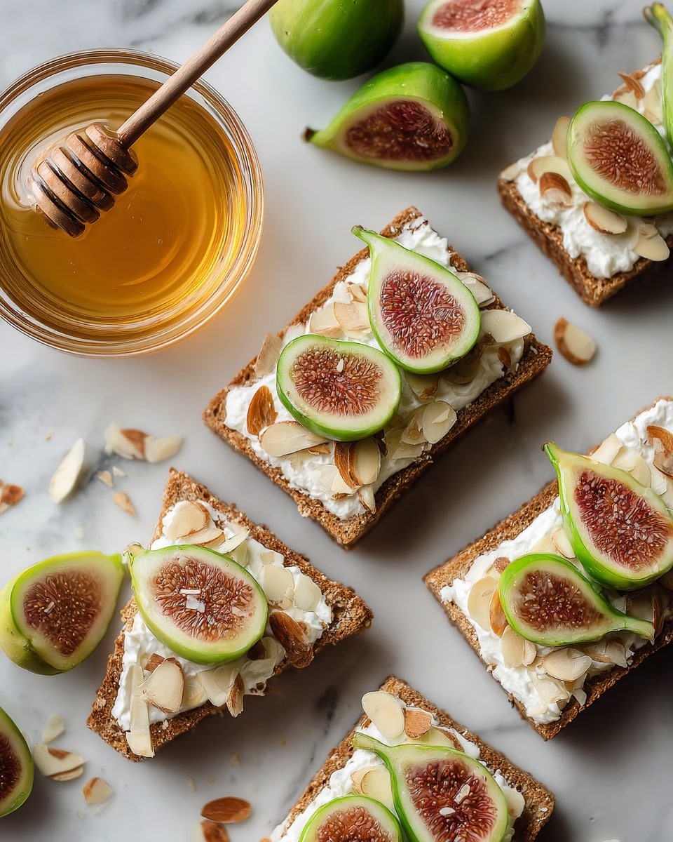 A round beige plate sits on a white marbled surface, holding seven small square pieces of brown crisp bread. Each piece has a creamy white layer spread on top and is decorated with halved light green figs with brown seeds in the center. Around the plate, there are whole light green figs and scattered thin, toasted almond slices. The figs and almond slices add a fresh, textured look with shades of green, white, and light brown. photo taken with an iphone --ar 4:5 --v 7