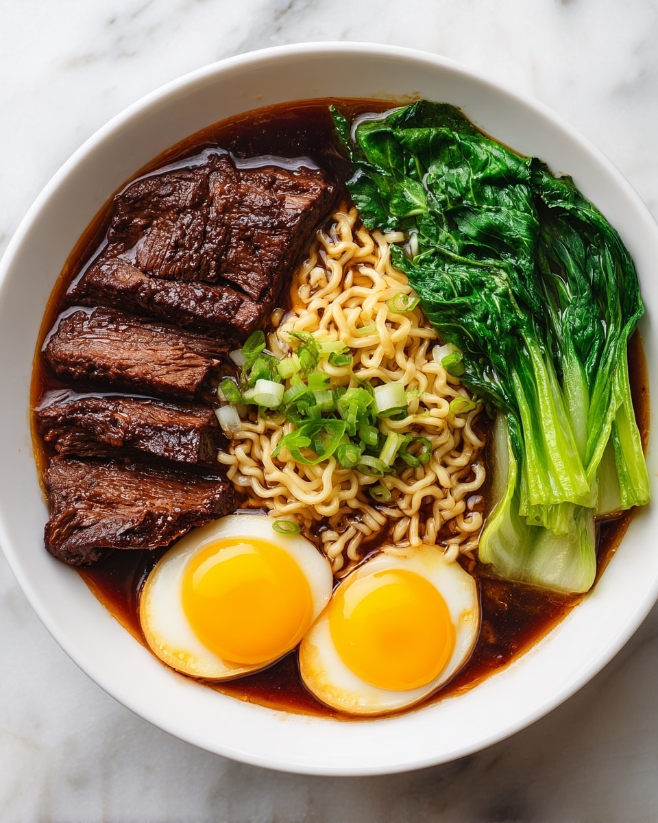 A white bowl sits on a white marbled surface, filled with dark brown broth as the base layer. On the right side inside the bowl are pale yellow ramen noodles with a soft, wavy texture. Layered on top and slightly to the left are two bright yellow sunny-side-up eggs with shiny, smooth yolks and white edges that look crisp in some spots. To the far left inside the bowl, there are four dark brown, tender meat pieces with visible grain texture. On the far right, a deep green leafy vegetable with a shiny, slightly wet look curves along the bowl’s edge. Scattered over the eggs and noodles are small green slices of scallion and some sesame seeds. Photo taken with an iphone --ar 4:5 --v 7