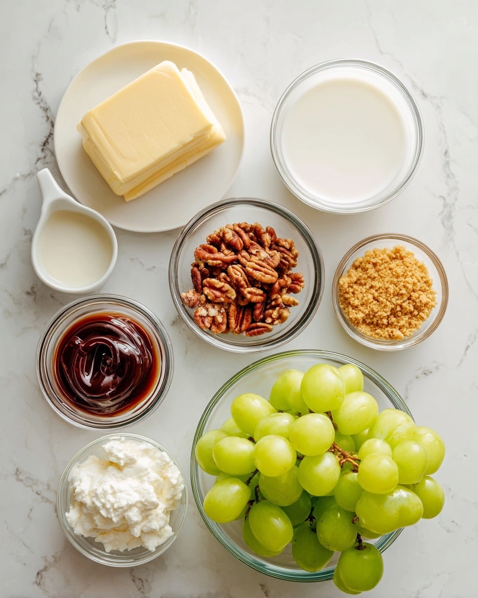 A collection of ingredients is arranged on a white marbled surface. In the center-right, there is a clear glass bowl filled with bright green grapes. Surrounding it are small clear glass bowls containing golden crushed nuts, dark reddish-brown sauce, chopped pecans, and a smooth white cream. On the left side, there is a small white plate holding a pale yellow block of butter, and next to it, a clear glass bowl with white milk. The setup is clean, neat, and well-lit. photo taken with an iphone --ar 4:5 --v 7