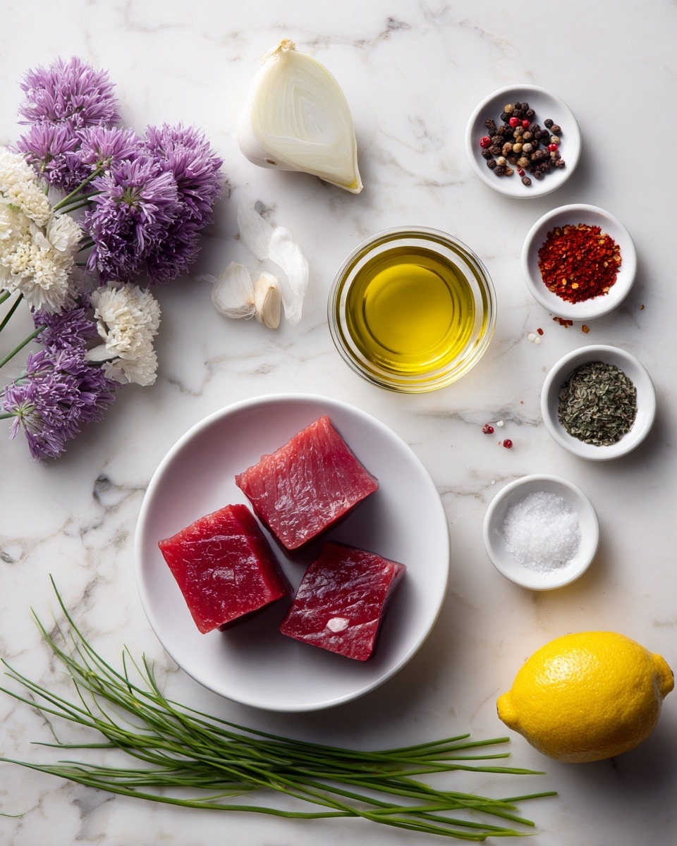 The image shows a white marbled surface with several small white bowls and ingredients neatly arranged. At the center, there is a small white bowl holding two thick, dark red pieces of raw tuna. Surrounding it are small bowls and ingredients: a glass bowl of golden olive oil at the top center, a small bowl of white vinegar to the top left, and on the top right, tiny bowls of red Espelette pepper, white salt, and white sugar, each distinct in color and texture. To the left side, there is a small wedge of white onion near a small bowl filled with purple and white edible flowers. Fresh green chives lie diagonally on the left of the tuna bowl. On the far right, there is a whole yellow lemon. Everything is set on a clean white marbled surface, creating a fresh and minimal look. photo taken with an iphone --ar 4:5 --v 7