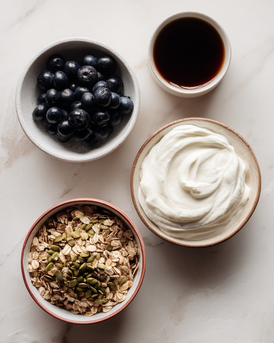 The image shows four different bowls on a white marbled surface. The top right bowl is filled with a thick, white, creamy substance. The top left bowl contains a small pile of dark blue, plump blueberries. The bottom right bowl holds a mix of granola with visible seeds, oats, and nuts, all in light brown and green colors. The bottom left cup contains a dark brown liquid, possibly tea or coffee, with a smooth surface. All bowls and the cup are white except the granola bowl, which is white on the inside but has a reddish exterior. Photo taken with an iphone --ar 4:5 --v 7